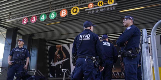Police officers patrol a subway station in New York, Tuesday, April 12, 2022. (AP Photo/Seth Wenig)