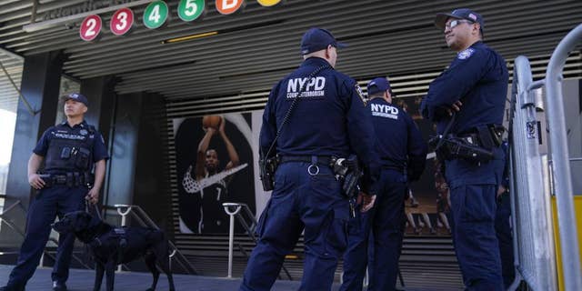 Police officers patrol a subway station in New York, Tuesday, April 12, 2022. (AP Photo/Seth Wenig)