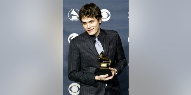 Singer John Mayer poses with his Grammy Award for Best Male Pop Vocal Performance for his song "Your Body is A Wonderland," at the 45th annual Grammy Awards at New York's Madison Square Garden, on Feb. 23, 2003. (REUTERS/Peter Morgan)