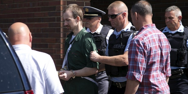 David Sweat is escorted out of the court house following his arraignment at Clinton County court, in Plattsburgh, New York August 20, 2015.