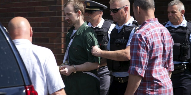 David Sweat is escorted out of the court house following his arraignment at Clinton County court, in Plattsburgh, New York August 20, 2015.