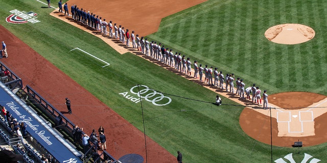The Boston Red Sox stand on the third-base line during introductions before the start of the game against the New York Yankees at Yankee Stadium in the Bronx, on Apr 8, 2022. (Tom Horak-USA TODAY Sports)