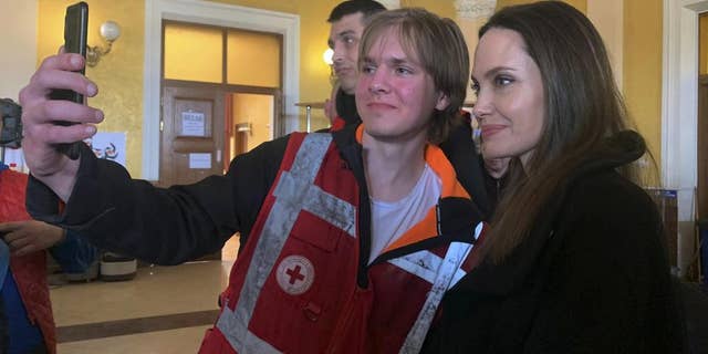 Angelina Jolie, Hollywood movie star and UNHCR goodwill ambassador, poses for photo with her fans in Lviv, Ukraine, Saturday, April 30, 2022.