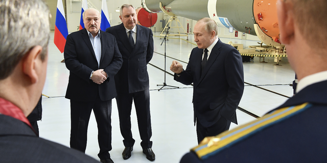 Russian President Vladimir Putin, right, Belarusian President Alexander Lukashenko, left, and Russian Roscosmos head Dmitry Rogozin visit the Vostochny cosmodrome.