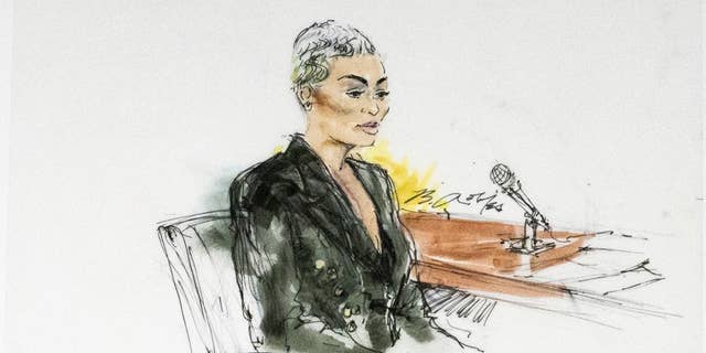 In this courtroom artist sketch, former reality television star Blac Chyna sits in court in Los Angeles, Tuesday, April 19, 2022.
