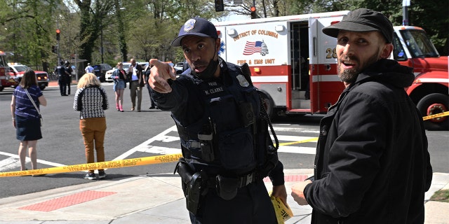 Police secure the area around the Connecticut Avenue and Tilden Street intersection after a reported shooting in Washington, D.C., on April 22, 2022.