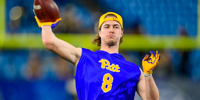 Kenny Pickett #8 of the Pittsburgh Panthers during warmups for the ACC Championship game at Bank of America Stadium on December 04, 2021 in Charlotte, North Carolina.