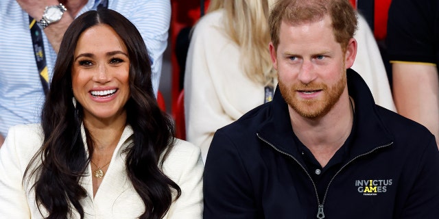 Meghan, Duchess of Sussex, and Prince Harry, Duke of Sussex, watch the sitting volley ball competition on day 2 of the Invictus Games 2020 at Zuiderpark, April 17, 2022, in The Hague, Netherlands.