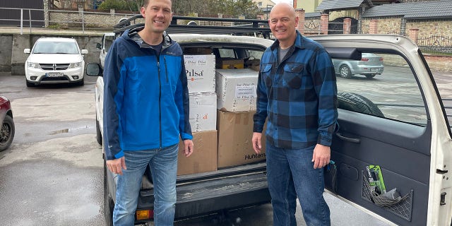 Dr. Shawn Galbraith and Dr. Daniel Smith prepare to deliver a load of donated medical supplies into Ukraine.