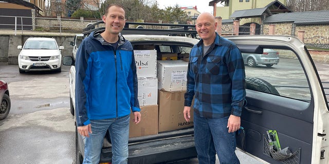 Dr. Shawn Galbraith and Dr. Daniel Smith prepare to deliver a load of donated medical supplies into Ukraine.