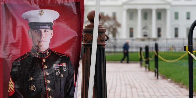 A poster photo of U.S. Marine Corps veteran and Russian prisoner Trevor Reed stands in Lafayette Park near the White House March 30, 2022.