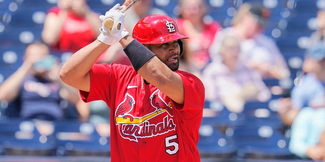 St. Louis Cardinals' Albert Pujols (5) bats in the first inning of a spring training baseball game against the Washington Nationals, Wednesday, March 30, 2022, in West Palm Beach, Fla.