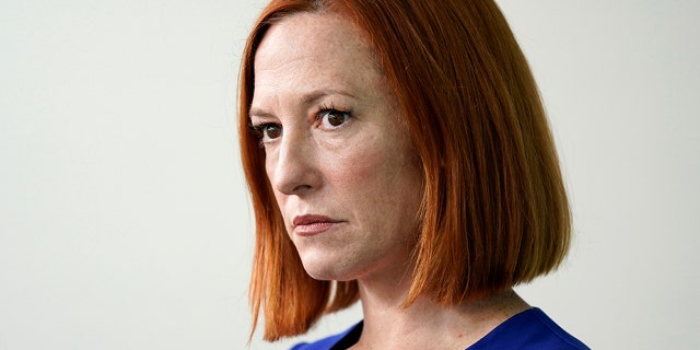 White House press secretary Jen Psaki listens as Council of Economic Advisers member Jared Bernstein speaks during a press briefing at the White House, Friday, April 1, 2022, in Washington.