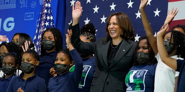 Vice President Kamala Harris poses for a photo with students at Thomas Elementary School in Washington, Monday, April 4, 2022. (AP Photo/Susan Walsh)