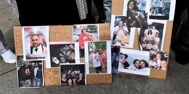 Photographs of De'vazia Turner are on display as his mother Penelope Scott speaks to the media during an interview at the corner of 10th and K street in Sacramento, Calif., on Monday. Turner was shot and killed after a shooting broke out early Sunday morning. 