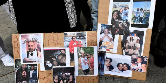 Photographs of De'vazia Turner are on display as his mother Penelope Scott speaks to the media during an interview at the corner of 10th and K street in Sacramento, Calif., on Monday. Turner was shot and killed after a shooting broke out early Sunday morning.