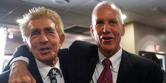 Former Philadelphia 76ers coach Gene Shue, left, and his former player and 76ers coach Doug Collins are seen at a news conference in Philadelphia, Monday, May 24, 2010.