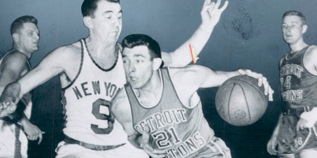 Detroit Pistons' Gene Shue ( 21 ) is defended by New York Knickerbockers' Richie Guerin during an NBA basketball game, Dec. 30, 1959 in Philadelphia. The NBA announced Shue's passing on Monday, April 4, 2022. He was 90.