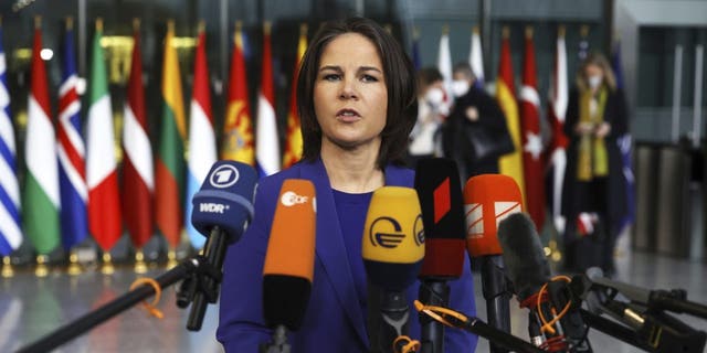 German Foreign Minister Annalena Baerbock speaks with the media as she arrives for a meeting of NATO foreign ministers at NATO headquarters in Brussels, Thursday, April 7, 2022. 