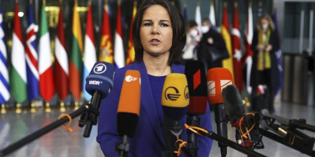 German Foreign Minister Annalena Baerbock speaks with the media as she arrives for a meeting of NATO foreign ministers at NATO headquarters in Brussels, Thursday, April 7, 2022. 