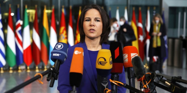 German Foreign Minister Annalena Baerbock speaks with the media as she arrives for a meeting of NATO foreign ministers at NATO headquarters in Brussels, Thursday, April 7, 2022. NATO foreign ministers are meeting to discuss how to bolster their support to Ukraine, including by supplying weapons to the conflict-torn country, without being drawn into a wider war with Russia. 