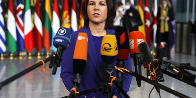 German Foreign Minister Annalena Baerbock speaks with the media as she arrives for a meeting of NATO foreign ministers at NATO headquarters in Brussels, Thursday, April 7, 2022. NATO foreign ministers are meeting to discuss how to bolster their support to Ukraine, including by supplying weapons to the conflict-torn country, without being drawn into a wider war with Russia.