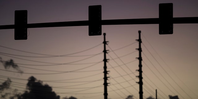 Traffic lights are out of service on a street in San Juan, Puerto Rico, early Thursday, April 7, 2022. 