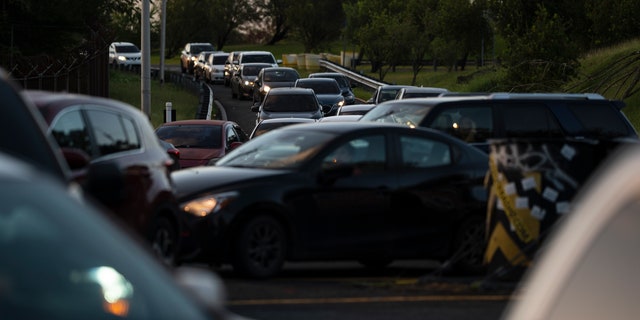 Traffic piles up along R.H. Tood Avenue after a crash near an intersection during a blackout in San Juan, Puerto Rico, early Thursday, April 7, 2022. 
