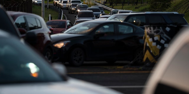 Traffic piles up along R.H. Tood Avenue after a crash near an intersection during a blackout in San Juan, Puerto Rico, early Thursday, April 7, 2022. 