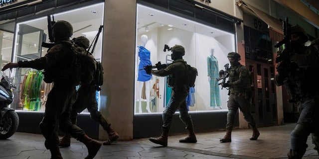 Reuters dragged for 'evil', 'woeful' headline on terrorist attack that killed Israeli twos Israeli security forces search for assailants near the scene of a shooting attack in Tel Aviv, Israel on Thursday. Israeli health officials say two people were killed and at least eight others wounded in a shooting in central Tel Aviv.