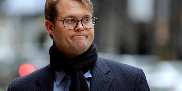 Mark Riddell arrives at federal court in Boston on April 12, 2019. Riddell, a former Florida prep school administrator who took college entrance exams for students in exchange for cash to help wealthy parents get their kids into elite universities, was sentenced to four months in prison Friday.  