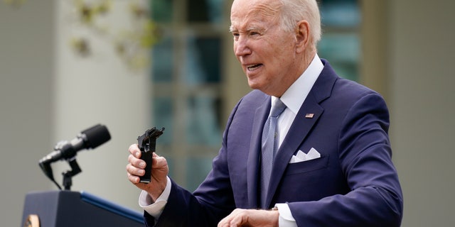 President Joe Biden announced the administration's ghost gun rule on April 11, 2022, holding a fragment of a pistol in the White House Rose Garden.  (AP Photo/Carolyn Custer)