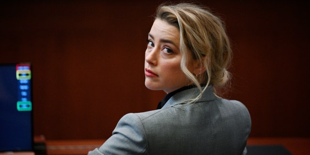 US actress Amber Heard is seen inside the courtroom during the $50 million Depp vs Heard defamation trail at the Fairfax County Circuit Court April 12, 2022, in Fairfax, Virginia.