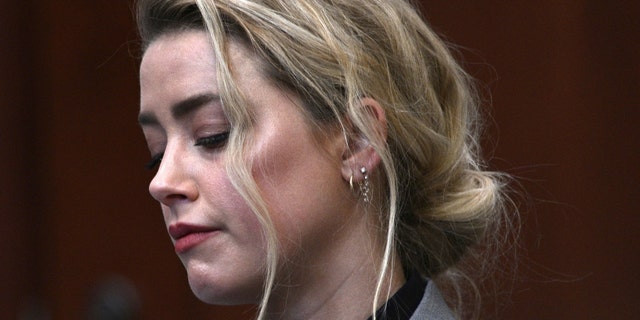 Actress Amber Heard inside the courtroom at the Fairfax County Circuit Court, April 12, 2022, in Fairfax, Va. A jury in Virginia is scheduled to hear opening statements in a defamation lawsuit filed by Johnny Depp against his ex-wife, Amber Heard.