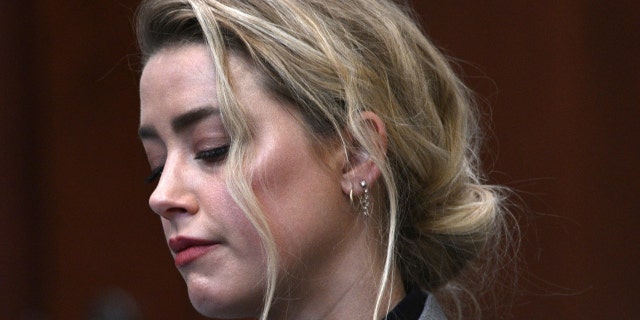Actress Amber Heard inside the courtroom at the Fairfax County Circuit Court, April 12, 2022, in Fairfax, Va. A jury in Virginia is scheduled to hear opening statements in a defamation lawsuit filed by Johnny Depp against his ex-wife, Amber Heard.