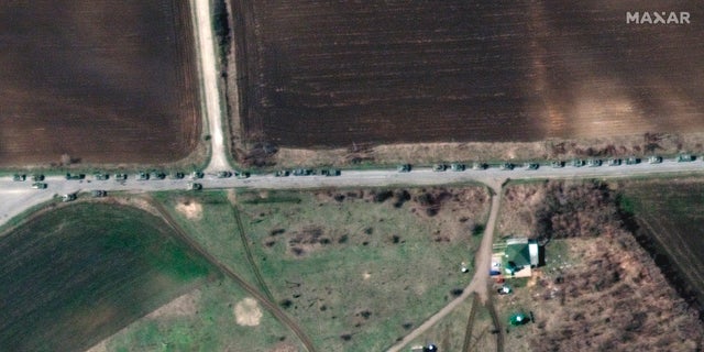 This satellite image provided by Maxar Technologies shows a closer view of a convoy of Russian military vehicles along T-1313 highway near Bilokurakyne, Ukraine, on Monday, April 11, 2022.