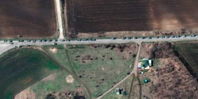 This satellite image provided by Maxar Technologies shows a closer view of a convoy of Russian military vehicles along T-1313 highway near Bilokurakyne, Ukraine, on Monday, April 11, 2022.