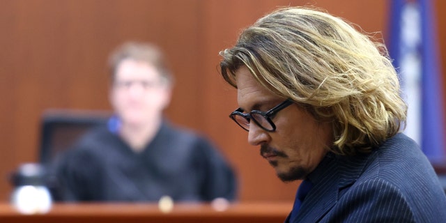Actor Johnny Depp attends his libel trial against his ex-wife Amber Heard at the Fairfax County Courthouse in Fairfax, Virginia, U.S., April 13, 2022.