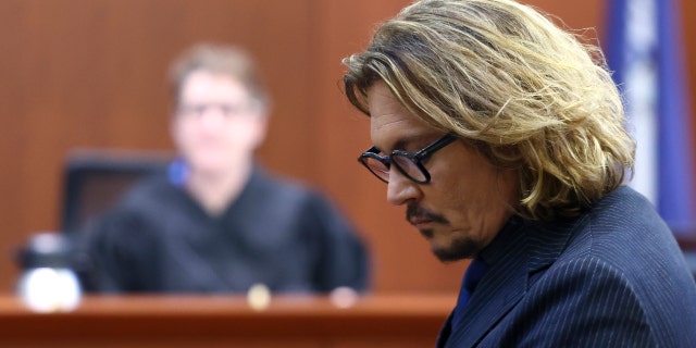 Actor Johnny Depp attends his defamation trial against his ex-wife Amber Heard at the Fairfax County Circuit Courthouse in Fairfax, Virginia, U.S., April 13, 2022.