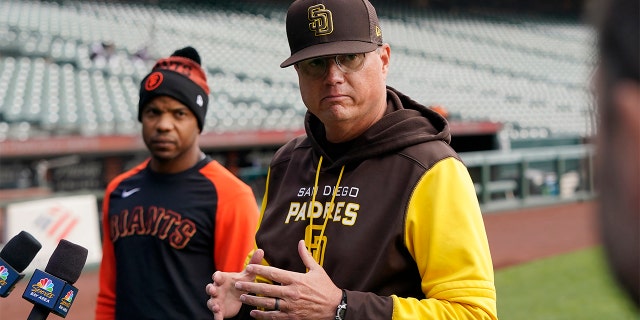 San Diego Padres third base coach Mike Shildt, right, speaks at a news conference next to San Francisco Giants first base coach Antoan Richardson before a game in San Francisco, Wednesday, April 13, 2022. 