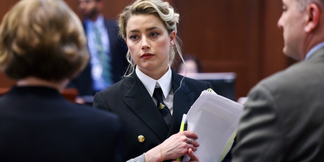 Actor Amber Heard attends Johnny Depp's defamation trial against her at the Fairfax County Circuit Courthouse in Fairfax, Virginia, U.S., April 13, 2022.