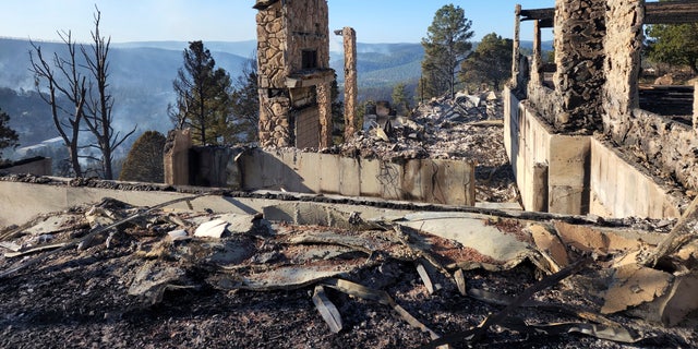 The remains of a home left after a wildfire spread through the Village of Ruidoso, N.M. on Wednesday, April 13, 2022. 
