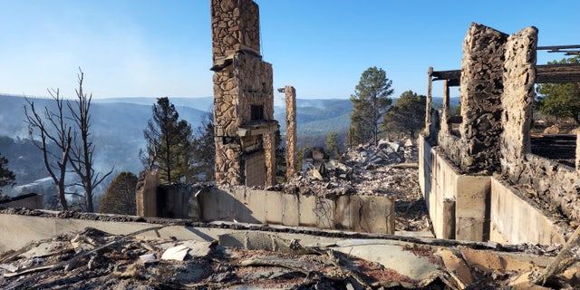 The remains of a home left after a wildfire spread through the Village of Ruidoso, N.M. on Wednesday, April 13, 2022. 