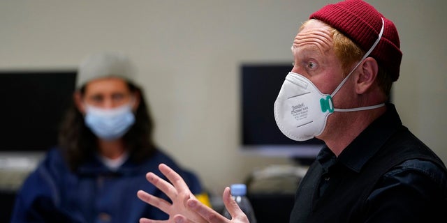 Instructor Douglas Arnwine speaks to his incarcerated students during a Mount Tamalpais College English class.