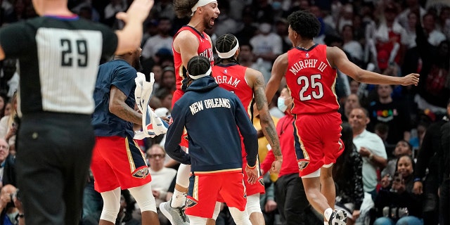 Members of the New Orleans Pelicans celebrate as time runs out in an NBA basketball play-in tournament game against the Los Angeles Clippers Friday, April 15, 2022, in Los Angeles. The Pelicans won 105-101.