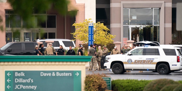 Members of law enforcement gather outside Columbiana Centre mall in Columbia, S.C., following a shooting, Saturday, April 16, 2022. 