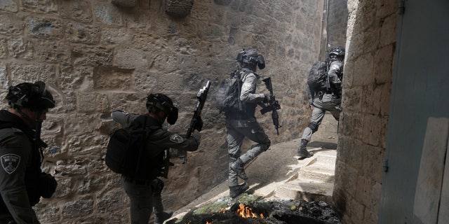 Israeli police is deployed in the Old City of Jerusalem, Sunday, April 17, 2022. Israeli police clashed with Palestinians outside Al-Aqsa Mosque after police cleared Palestinians from the sprawling compound to facilitate the routine visit of Jews to the holy site and accused Palestinians of stockpiling stones in anticipation of violence. 