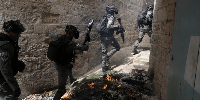 Israeli police is deployed in the Old City of Jerusalem, Sunday, April 17, 2022. Israeli police clashed with Palestinians outside Al-Aqsa Mosque after police cleared Palestinians from the sprawling compound to facilitate the routine visit of Jews to the holy site and accused Palestinians of stockpiling stones in anticipation of violence. 