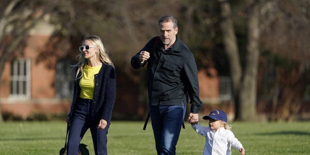 Hunter Biden walks with his wife, Melissa Cohen, and their son, Beau Biden, after stepping off Marine One at Fort Lesley J. McNair, Sunday, April 17, 2022, in Washington.