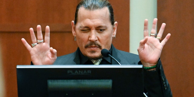 US actor Johnny Depp testifies during his defamation trial in the Fairfax County Circuit Courthouse in Fairfax, Virginia, on April 19, 2022. - Depp is suing ex-wife Amber Heard for libel after she wrote an op-ed piece in The Washington Post in 2018 referring to herself as a ìpublic figure representing domestic abuse.